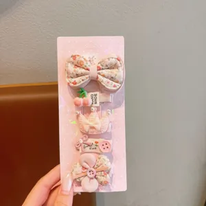 Cute cartoon kids hair clip set, pink fabric bow and crown side clips for cute girls daily wear.