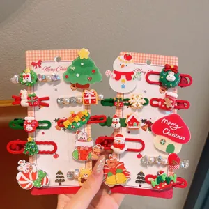 Detailed view of cute Christmas hair clips set featuring assorted festive designs and charms.