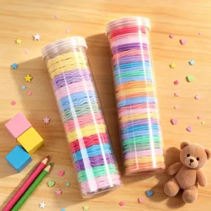 Canned colorful hair ties set in clear storage tubes, perfect for daily styling and ponytails.