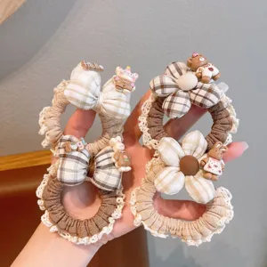 Cute plaid hair scrunchies with lace trim and cute animal charms for women daily wear.