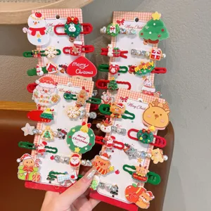 Christmas hair clips detailed view, featuring cute cartoon designs like snowman and reindeer for kids.