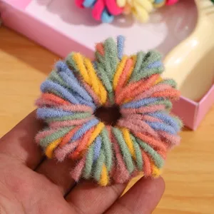 Colorful fuzzy hair scrunchie detail view, soft plush material for cute kids daily hairstyles.