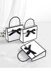 Minimalist black and white gift bags featuring elegant ribbon bows for premium packaging.