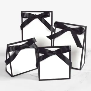Minimalist black and white gift bags with black satin bow set of four for event presentation