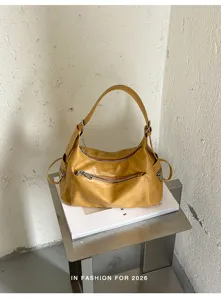 Retro yellow hobo shoulder bag for women, large capacity minimalist commuter daily style.