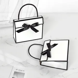 Simple black and white color-blocked bow handheld folding gift box for packaging.
