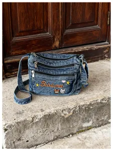 Blue denim crossbody bag with multi zip compartments and cute cat embroidery for daily.