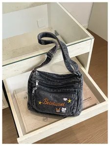 Casual denim crossbody bag with multi-compartments, cute cat embroidery, and stylish daily use.