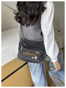 Multi-compartment denim crossbody bag for women, casual cute embroidered messenger bag daily.