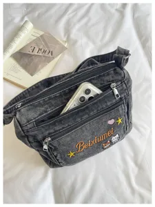 Casual denim crossbody bag with multi compartments and cute embroidery details for daily wear.
