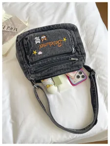 Dark grey denim messenger bag with cute cat embroidery, multi-pocket crossbody bag for women.