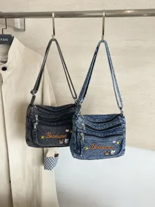 Fashion casual multi-compartment denim crossbody bag with cute embroidery and durable strap.
