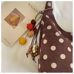 Brown suede polka dot shoulder bag with cute pendant detail, vintage casual daily handbag.