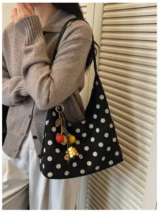 Casual black polka dot underarm shoulder bag detail, stylish women daily handbag with charm.
