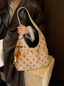 Stylish polka dot underarm shoulder bag for women, casual versatile everyday handbag.