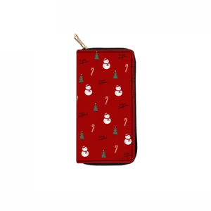 Primo piano portafoglio rosso di Natale con cerniera, motivo con pupazzo di neve e abete.
