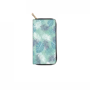 Close-up detail of tropical palm leaf pattern on PU leather long zipper wallet surface.