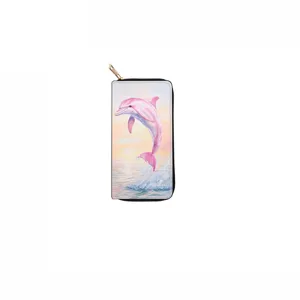 Close-up view of the long zipper wallet showcasing the vivid pink dolphin and sunset ocean print.