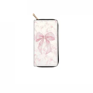 Detailed view of long zipper wallet featuring a pink watercolor bow on a retro background.
