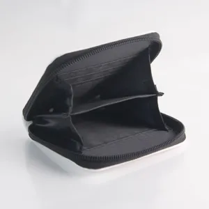 Close-up view of the interior and card slots of a black and white PU leather zipper wallet.
