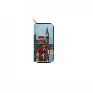 Detailed view of the London city print PU leather long zipper wallet with gold hardware.