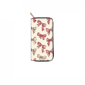 Detailed view of long zipper wallet featuring cute pink watercolor bows on cream background.