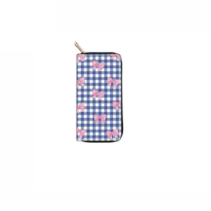 Close-up of long zippered wallet with blue white plaid and pink bows pattern detail.