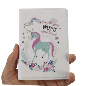 White PU leather unicorn passport holder with dream quote, durable travel document cover.