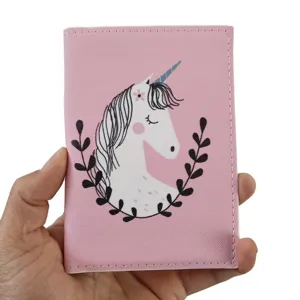 Pink PU leather passport holder detail, featuring cute unicorn print and leaf wreath design.