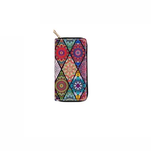Colorful mandala pattern detail view of long zipper wallet featuring vibrant geometric prints and gold hardware.