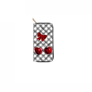 Detailed view of long zipper wallet featuring cute cherry and bow print on checkered pattern.