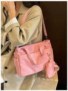 Sac bandoulière élégant en toile rose décontracté coréen avec petite pochette pratique.
