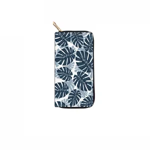 Long PU leather wallet with blue monstera leaf print and gold zipper, detailed view.