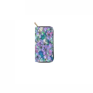 Detailed view of long floral PU zipper wallet with colorful blossom print and gold zipper.