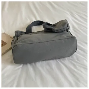 Sac à bandoulière en toile style coréen, sac à main de mode polyvalent pour femmes design 2026.