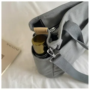 Sac bandoulière gris en toile avec sangle d'épaule et fermeture éclair sac pour femme