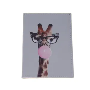 Close-up view of the grey PU leather passport holder featuring cute giraffe print.