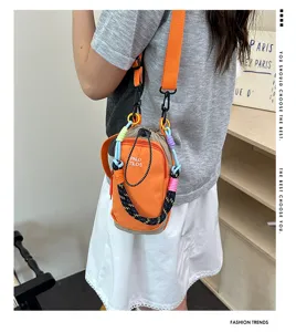 Detailed shot of trendy colorful crossbody pouch with climbing rope strap and drawstring design.