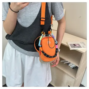 Colorful contrast outdoor phone bag detail view, trendy multi-functional crossbody bag.