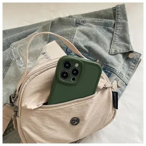 Casual nylon shell crossbody bag for women, lightweight mini phone bag with shoulder strap.