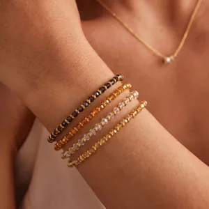Detailed shot of trendy multi-layer crystal beaded bracelets for women, stylish jewelry accessory.