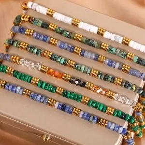 Detail close-up of colorful natural stone and crystal beaded bracelets with metallic spacers.