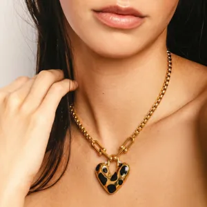 Stainless steel chunky link chain necklace with black spotted heart pendant for women.