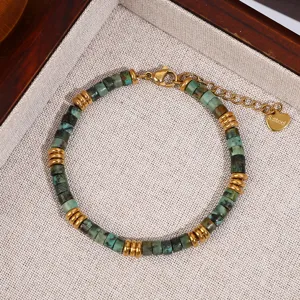 Turquoise stone bead and gold stainless steel spacer bracelet close up detail display.