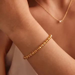 Detailed shot of a chic crystal beaded bracelet, elegant gold tone design for women jewelry.