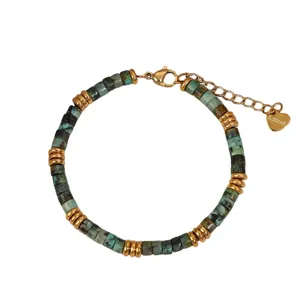 Turquoise stone beaded bracelet with gold stainless steel spacers and extension chain.