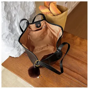 Large capacity black oil wax leather tote shoulder bag for women, interior zip pocket detail.
