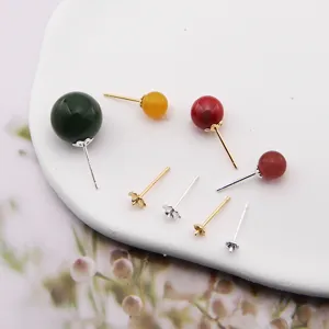Detailed view of S925 sterling silver DIY pearl earring pin blanks and jewelry accessories.