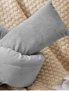 Grey velvet knot pillow detail, soft textured throw cushion for cozy living room bedroom decor.