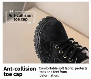 Kids black martin boots detail view, warm plush winter lining with anti-collision toe cap.